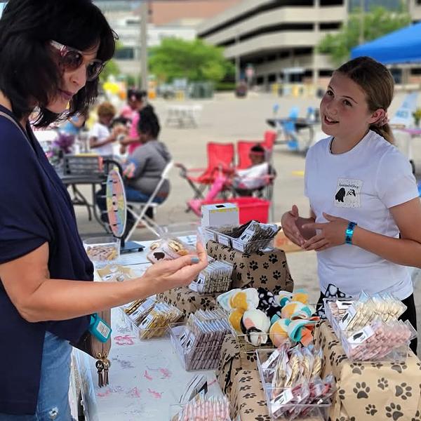 Young business owner helping a customer